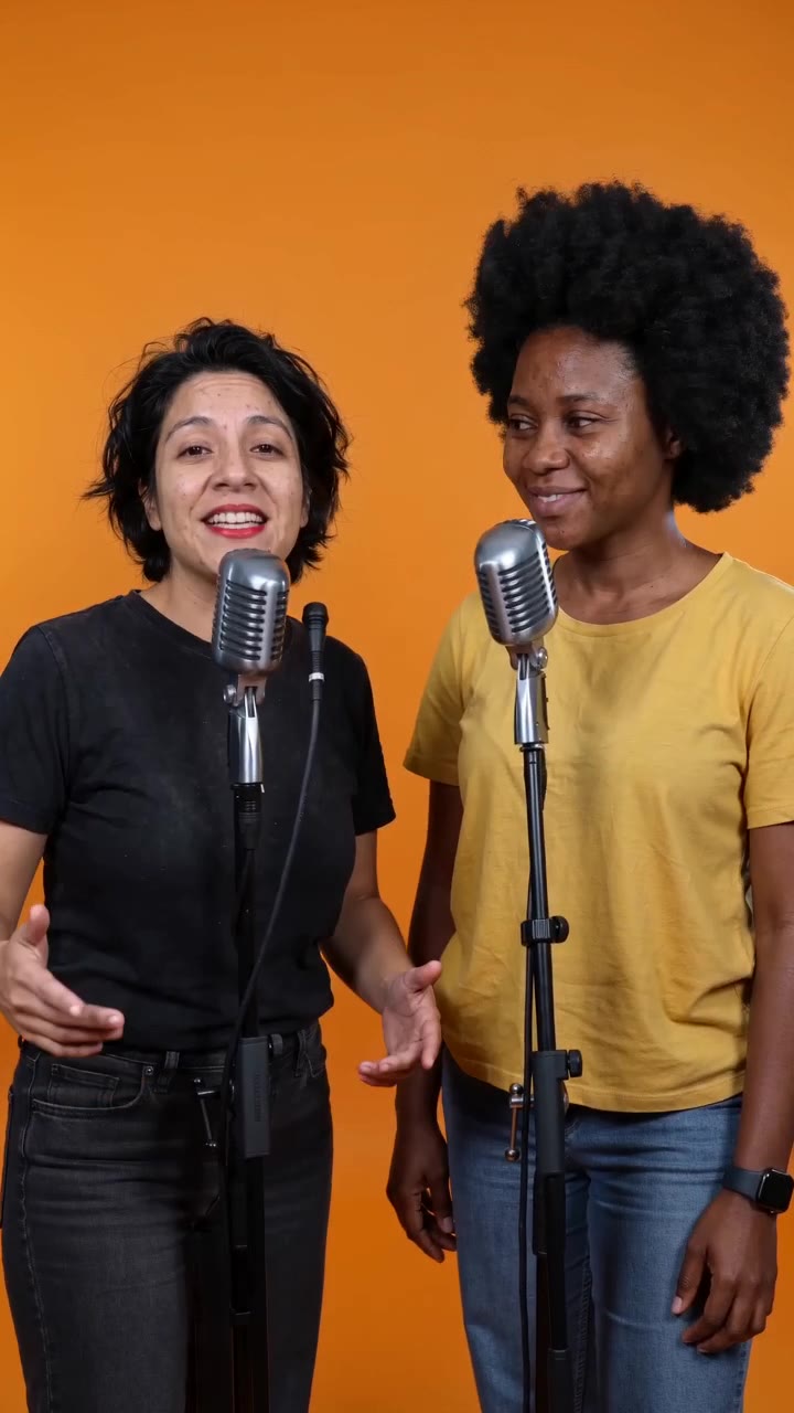 Reference example of two friends performing in an orange rap booth